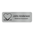 Caring Heart engraved healthcare name badge featuring a heart-shaped stethoscope design for nurses and healthcare staff.
